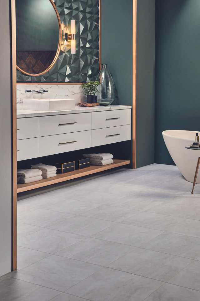 stone look luxury vinyl tile in modern green luxe bathroom